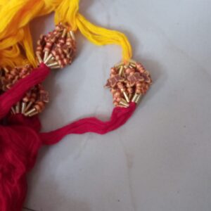 Red and yellow thread butterfly beads rakhi