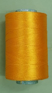 Yellow silk thread spool