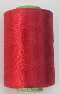 Red colour silk thread spool