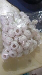 white cotton thread beads
