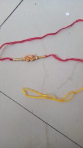 Red and yellow friendship band or rakhi