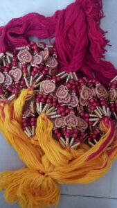 Red and yellow heart shape bead rakhi