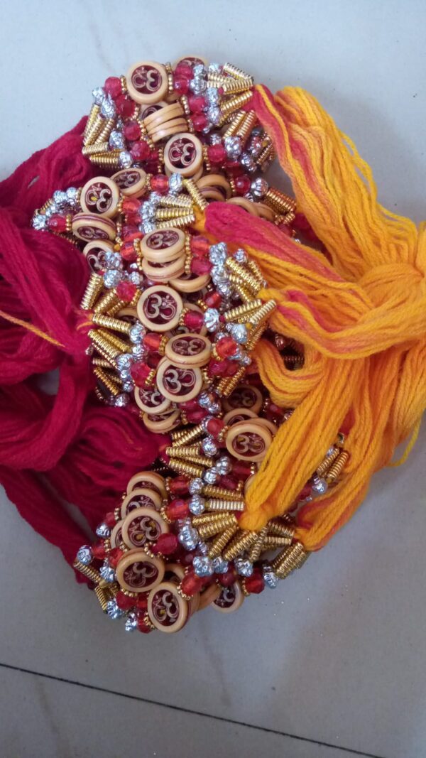 Red yellow thread Om rakhi round bead