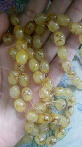 Yellow oval pattern glass beads