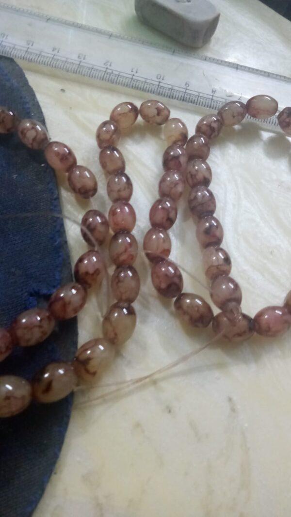 Brown oval pattern glass beads