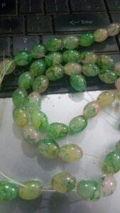 Green oval pattern glass beads