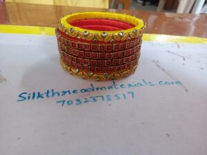 Red and yellow silk thread bangles