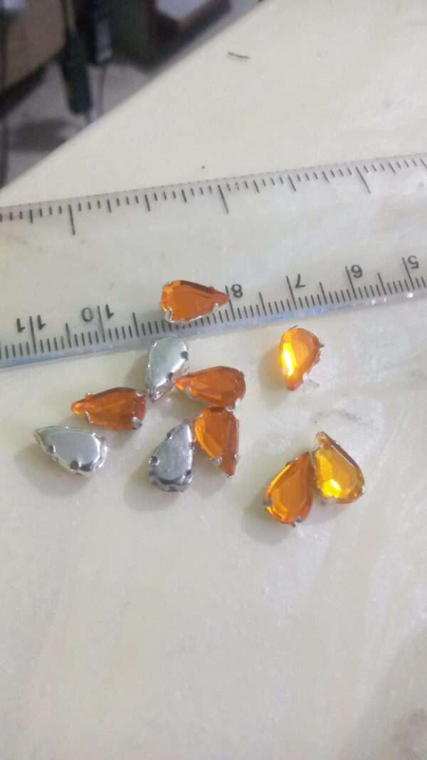 Sewable thilak shape kundans orange 10 pieces pack 10mm length