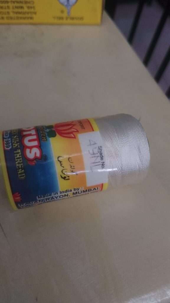 Cream silk thread 49NL Lotus brand