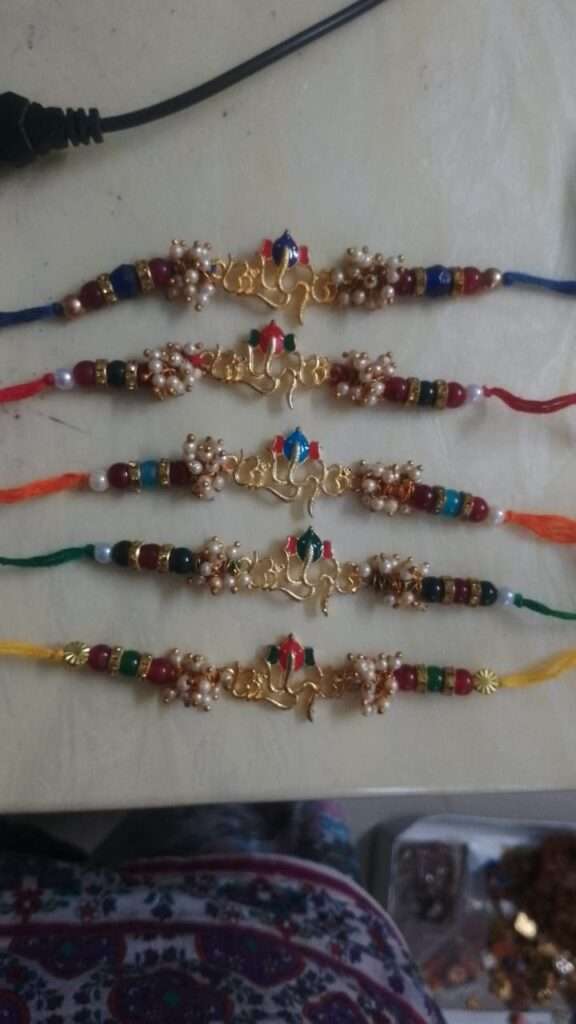 Traditional Ganesha rakhi with loreals, Om and Swastik