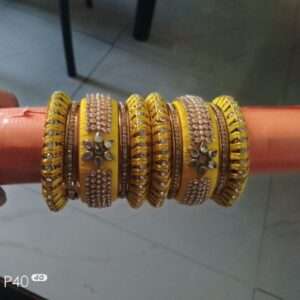 Yellow silk thread and metal bangles