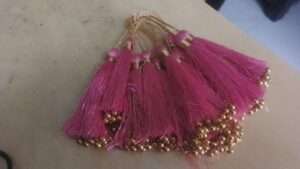 Light pink tassels with beads - 1 dozen