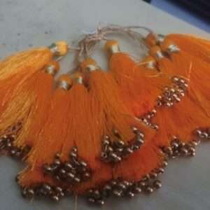 Orange tassels with beads - 1 dozen