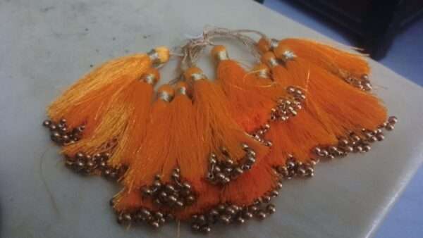 Orange tassels with beads - 1 dozen