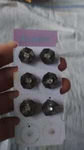 Black metal stud earrings with stone