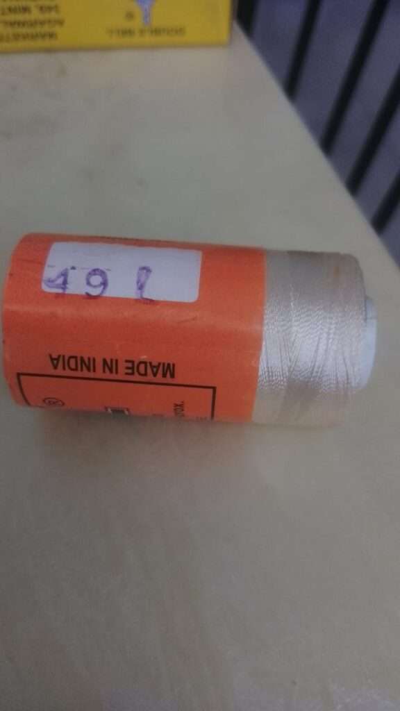 Cream colour silk thread spool code 49L Bell brand
