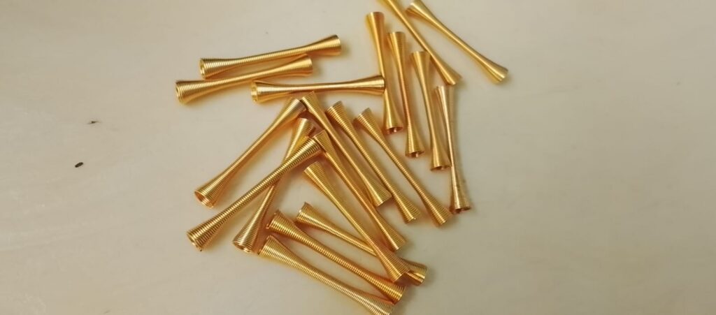 Long gold beads cone shape at ends
